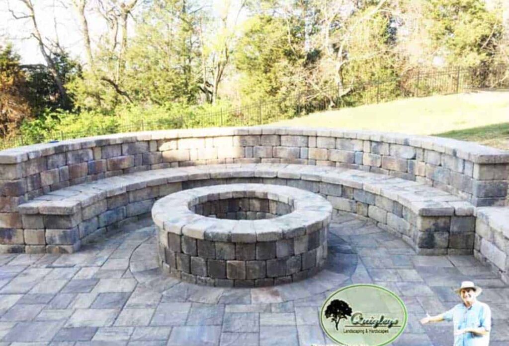 Belgard paver patio with large fire pit and seat wall that has a back Franklin