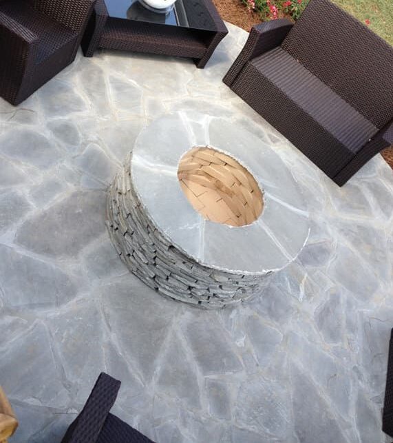 Gray natural stone patio with fire pit Arrington