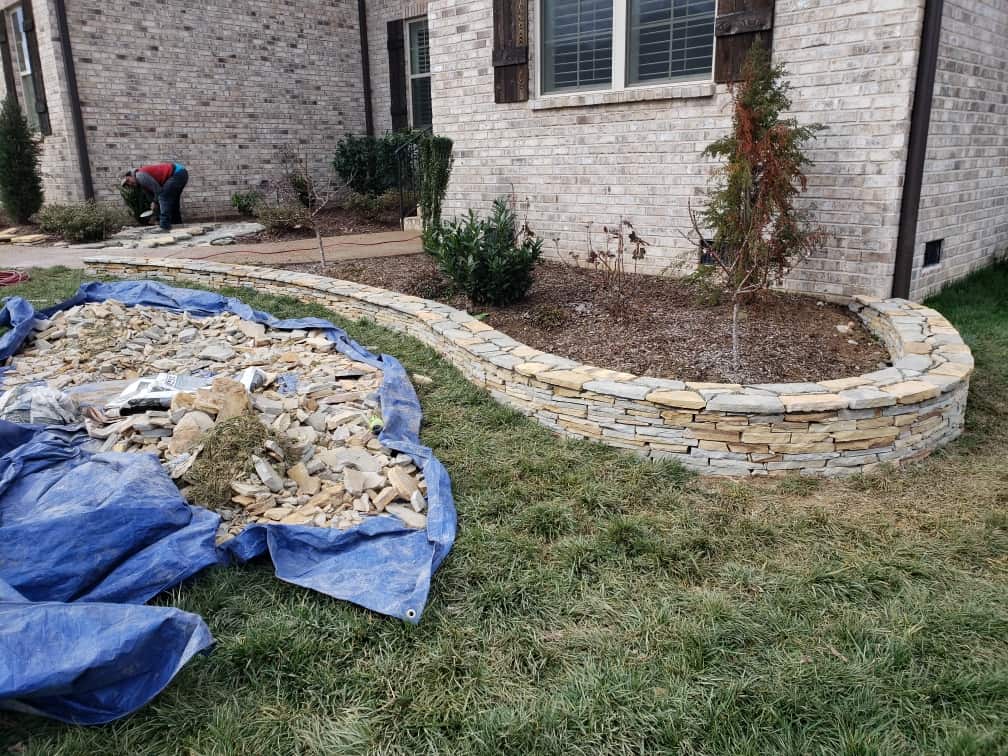 Romantic natural stone decorative garden wall with landscaping Brentwood