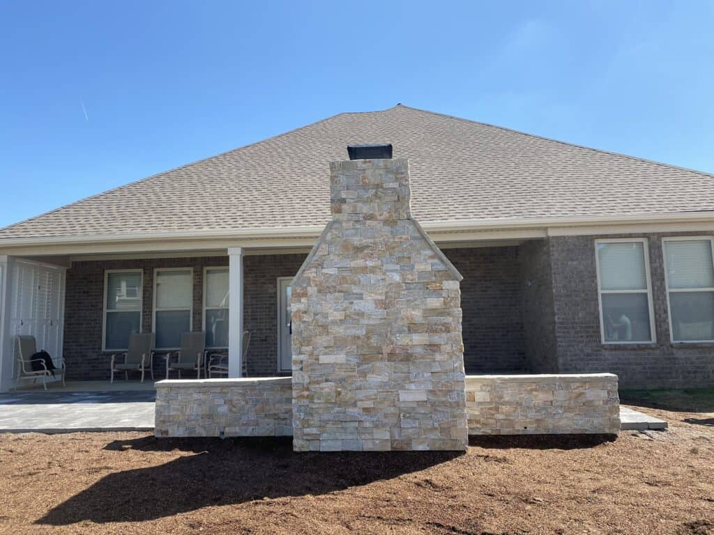 Stone fireplace and paver patio Forest Hills